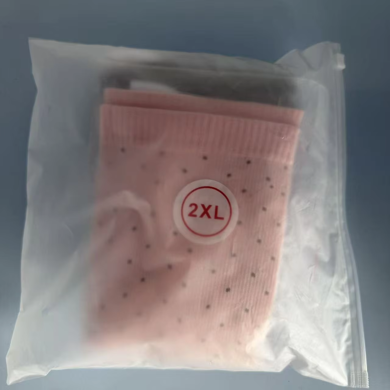 Regular clear poly bag packaging with 2XL size sticker for plus size compression socks